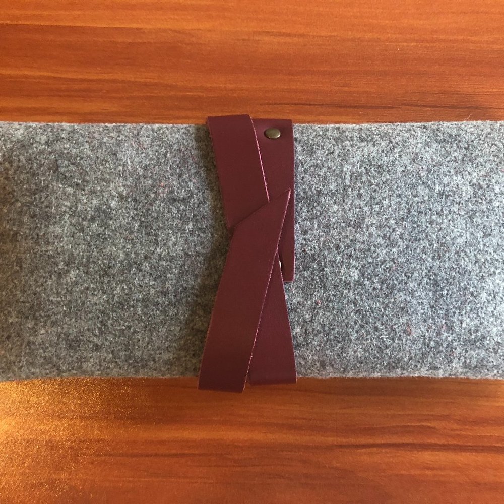 Grey felt clutch with leather wrap